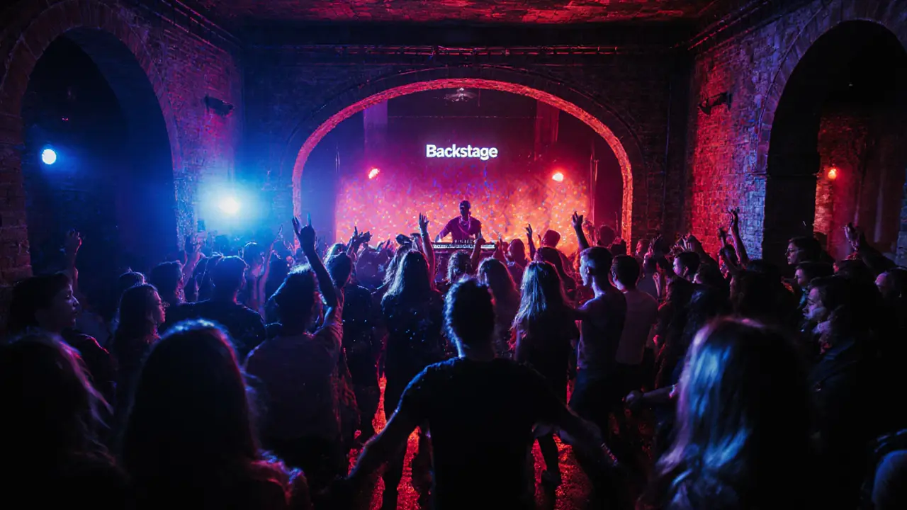 Crowd dancing under pulsing neon lights in a converted theater club in Munich.